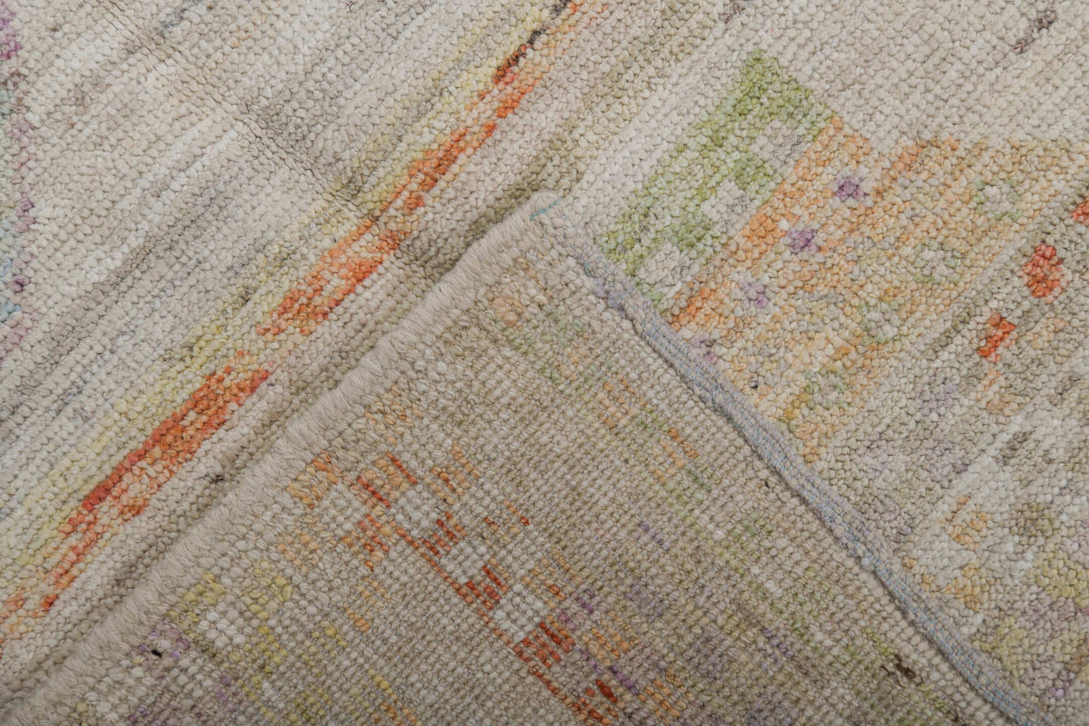 5' x 6' one-of-a-kind handmade vintage Tulu rug. Color palette: ivory, sage, apricot, pale blue, butter, taupe, green