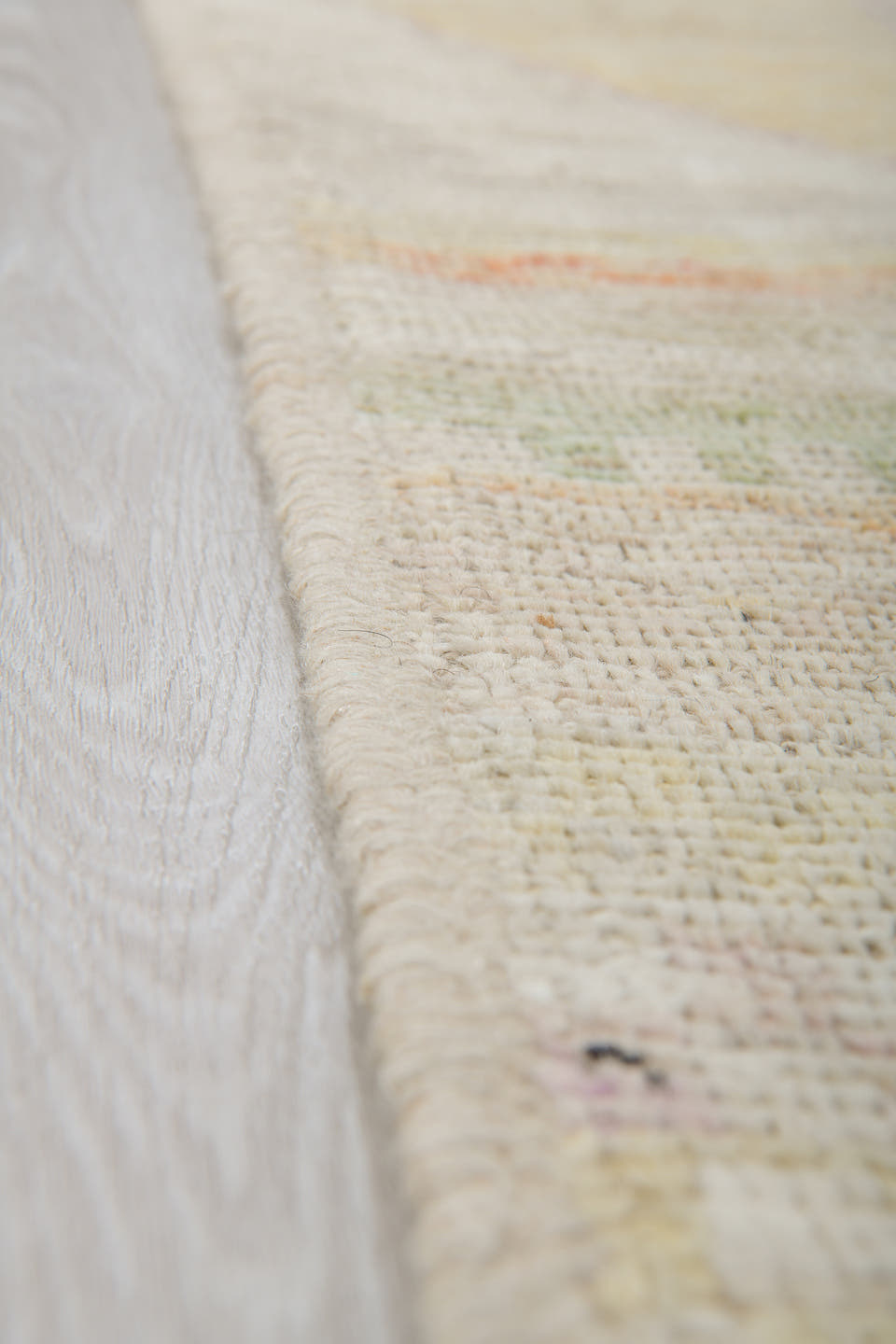 5' x 6' one-of-a-kind handmade vintage Tulu rug. Color palette: ivory, sage, apricot, pale blue, butter, taupe, green