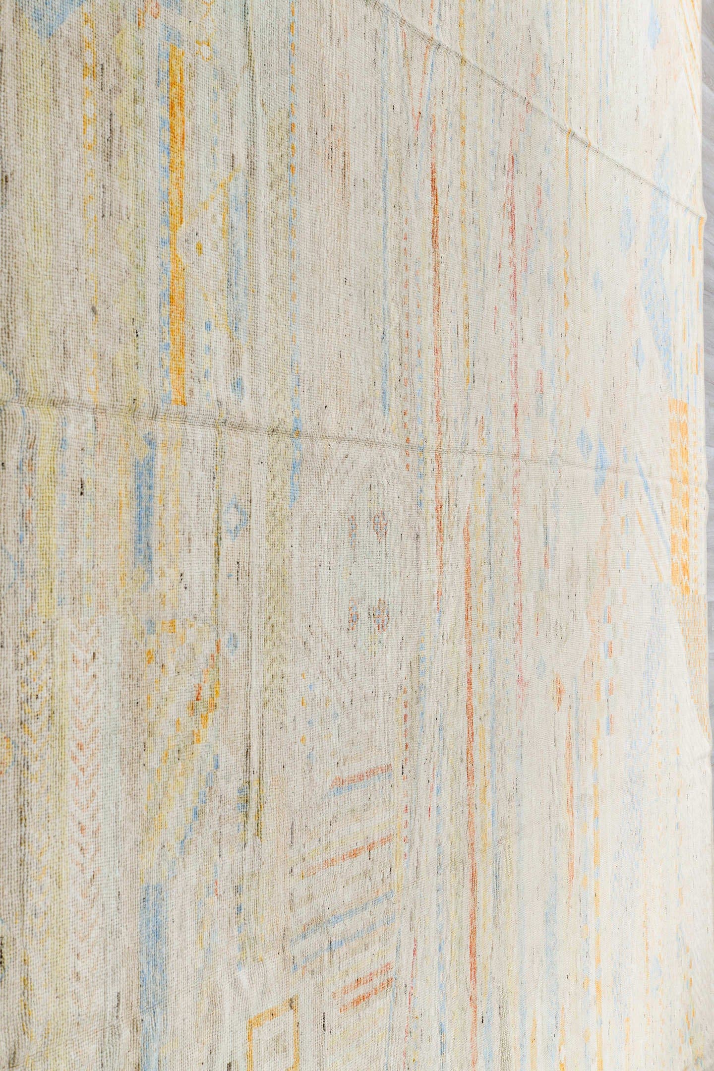 13' x 16' one-of-a-kind handmade vintage Tulu oversize rug. Color palette: ivory, pale blue, cream, saffron, soft coral