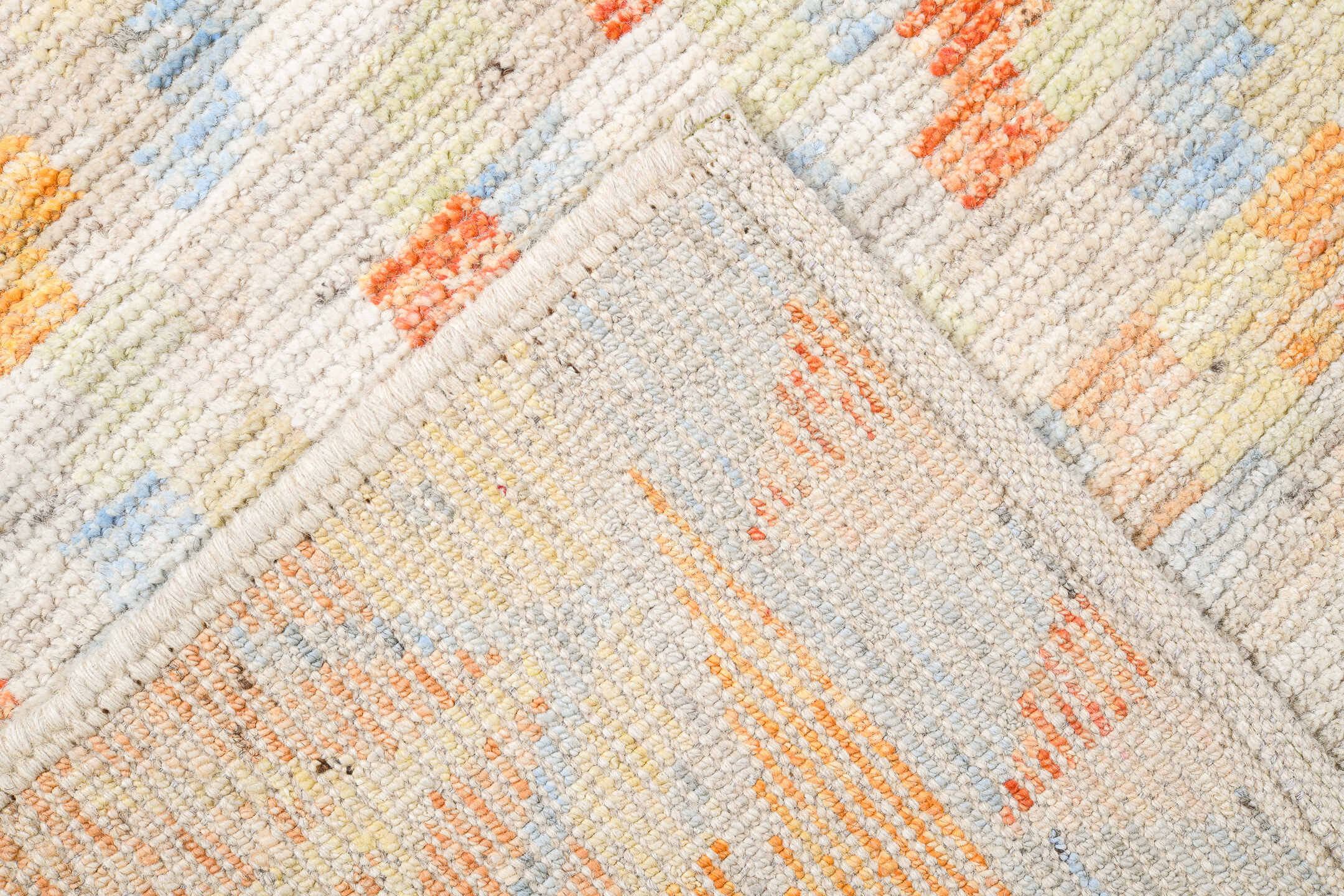 13' x 16' one-of-a-kind handmade vintage Tulu oversize rug. Color palette: ivory, pale blue, cream, saffron, soft coral
