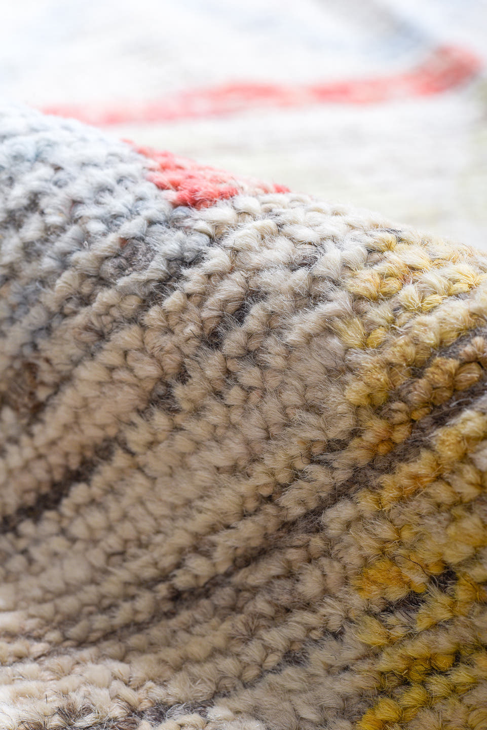 12' x 15' one-of-a-kind handmade vintage Tulu oversize rug. Color palette: ivory, coral, pale blue, butter yellow, sage