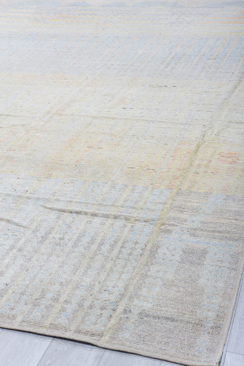 13' x 16' one-of-a-kind handmade vintage Tulu oversize rug. Color palette: ivory, pale blue, cream, peach, taupe, light gray