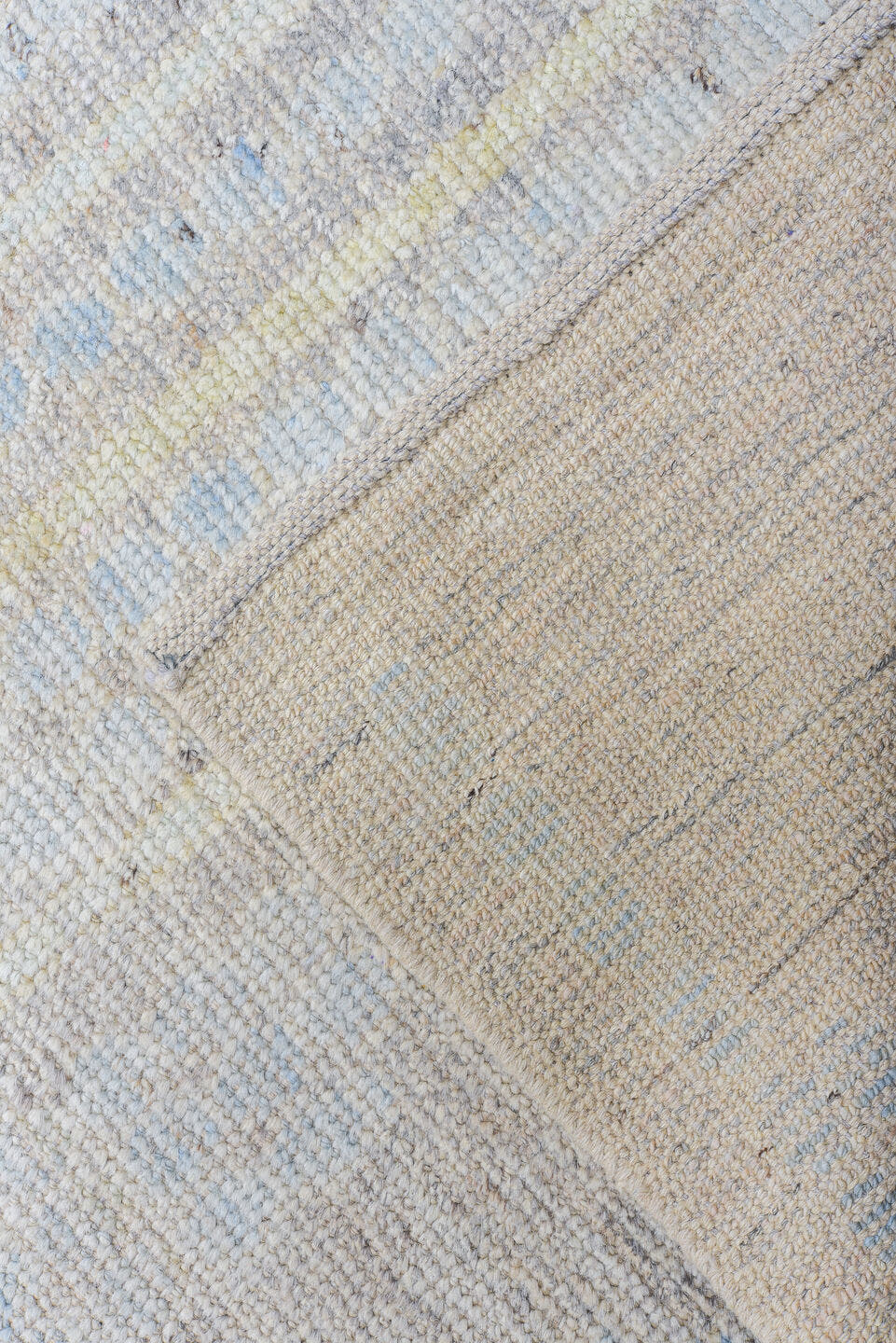 13' x 16' one-of-a-kind handmade vintage Tulu oversize rug. Color palette: ivory, pale blue, cream, peach, taupe, light gray