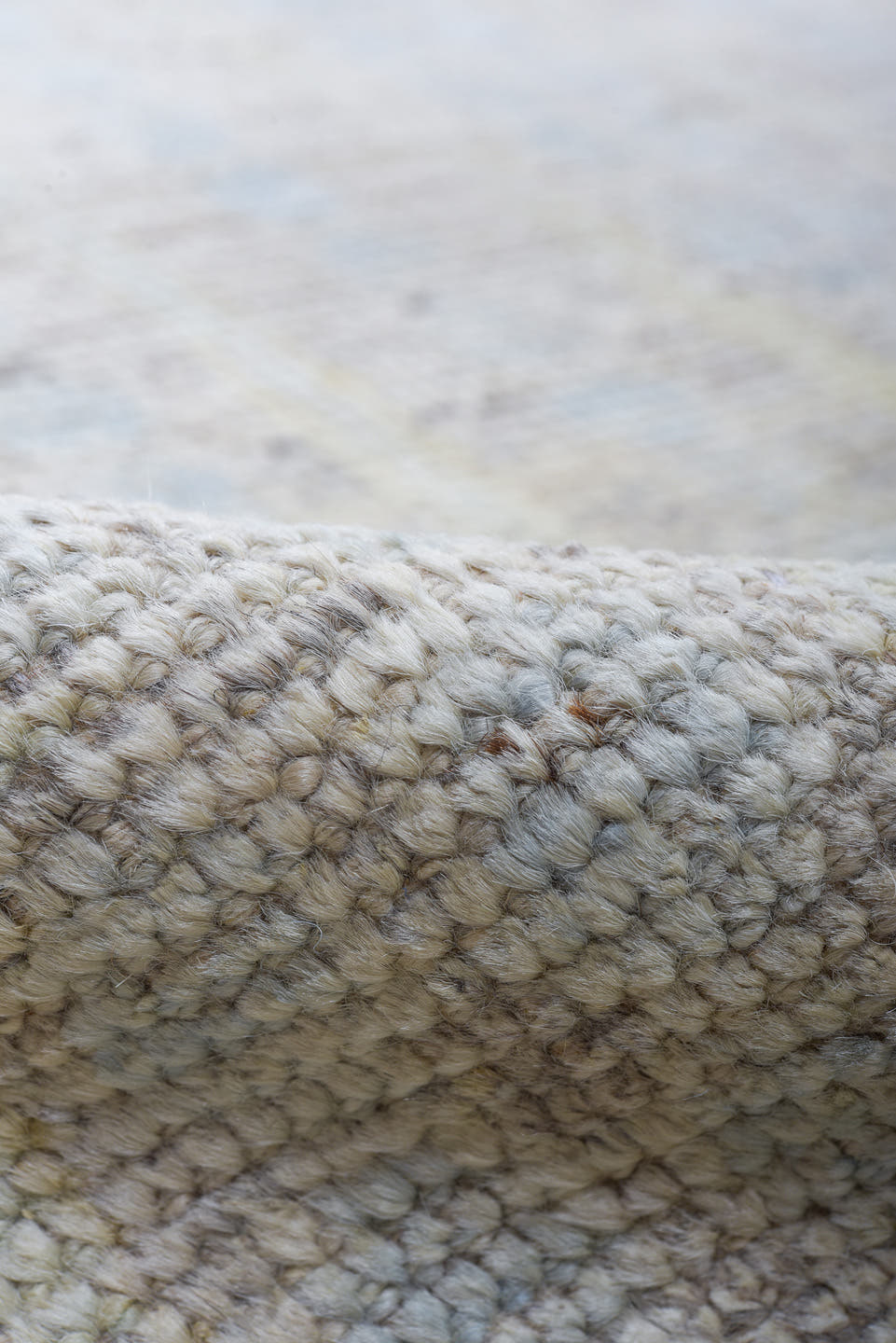 13' x 16' one-of-a-kind handmade vintage Tulu oversize rug. Color palette: ivory, pale blue, cream, peach, taupe, light gray