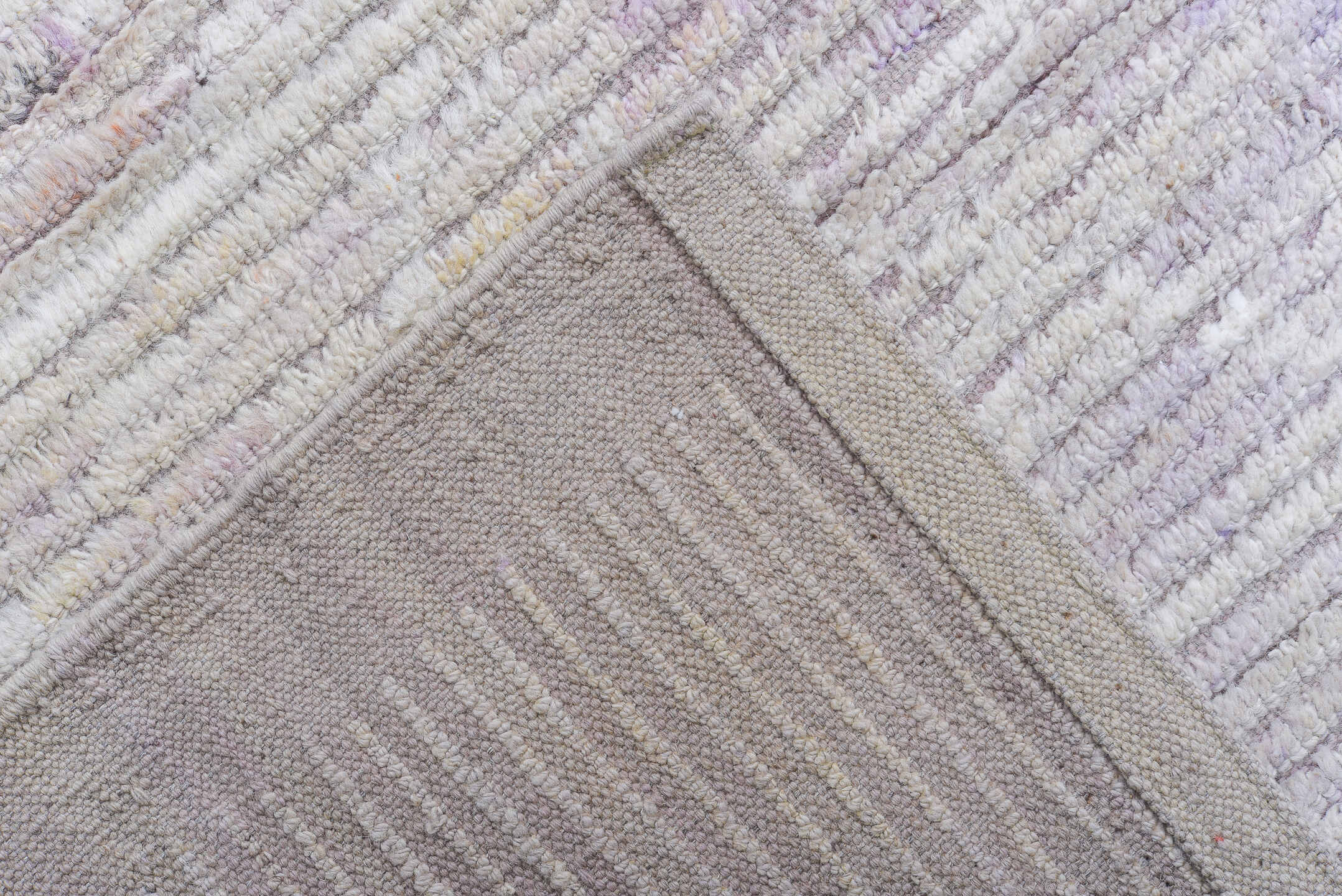13' x 16' one-of-a-kind handmade vintage Tulu oversize rug. Color palette: ivory, pale lavender, taupe, cream, purple, pink