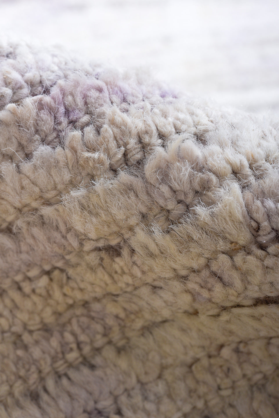 13' x 16' one-of-a-kind handmade vintage Tulu oversize rug. Color palette: ivory, pale lavender, taupe, cream, purple, pink
