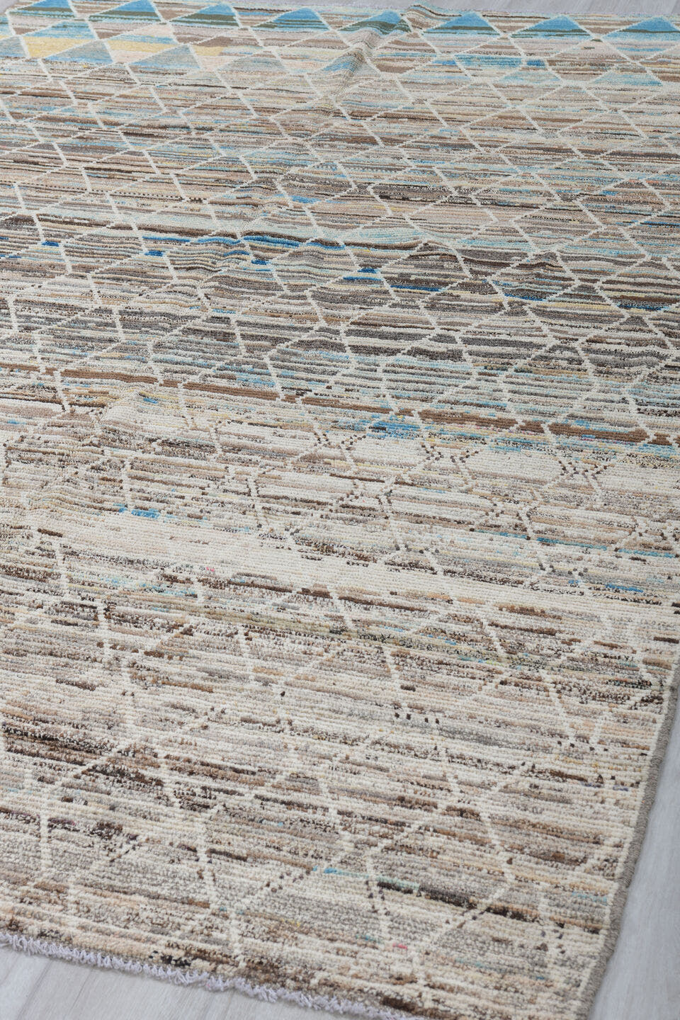 6' x 9' one-of-a-kind handmade vintage Tulu medium size rug. Color palette: ivory, taupe, brown, sky_blue, camel, slate