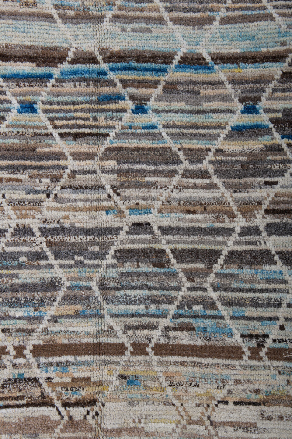 6' x 9' one-of-a-kind handmade vintage Tulu medium size rug. Color palette: ivory, taupe, brown, sky_blue, camel, slate