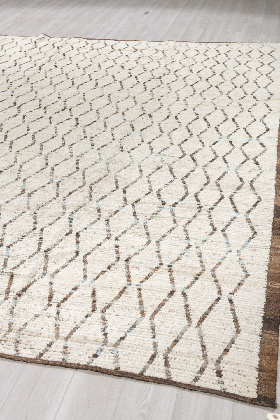 10' x 12' one-of-a-kind handmade vintage Tulu large size rug. Color palette: ivory, brown, charcoal, taupe, faint blue