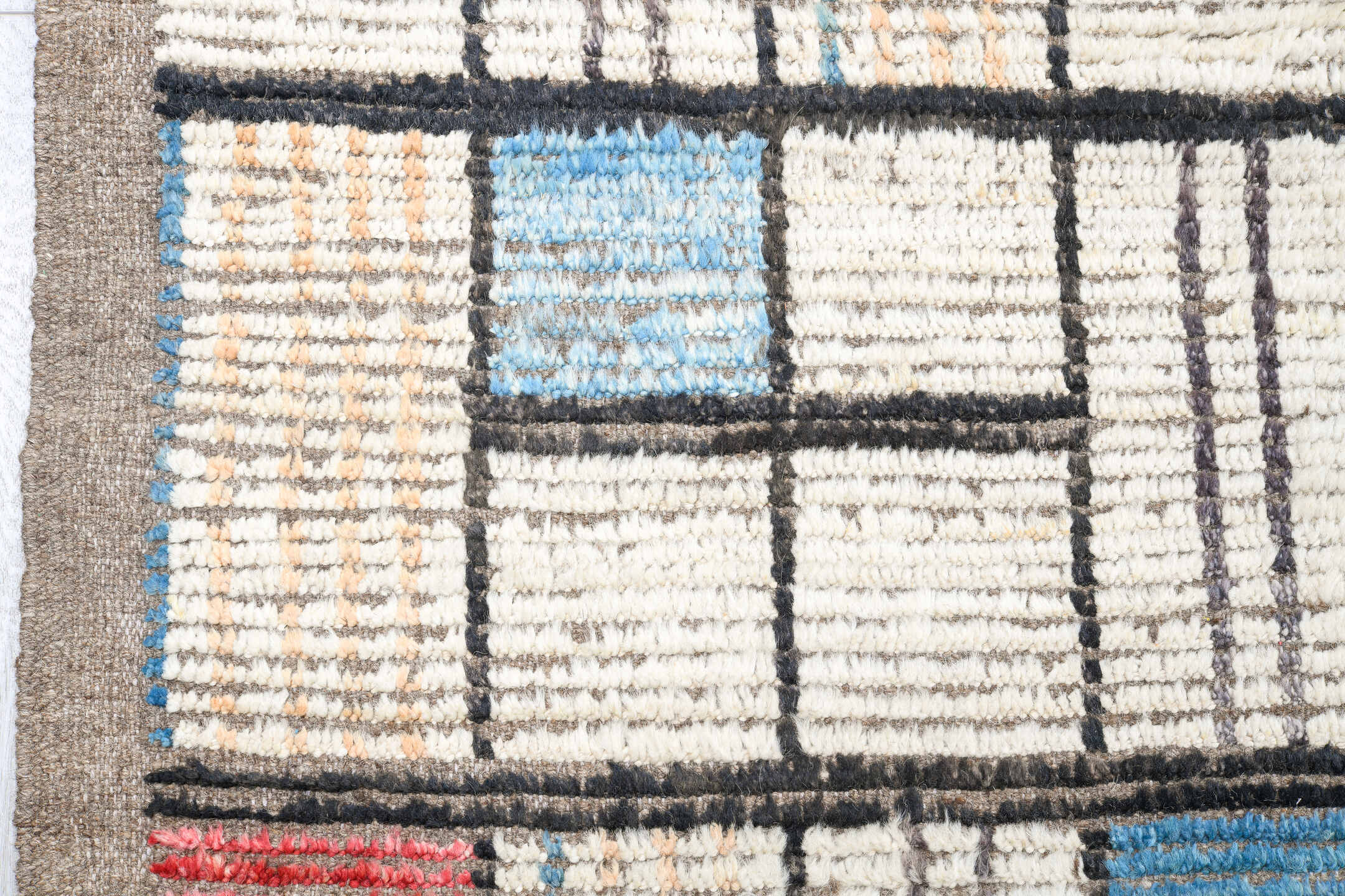 12' x 15' one-of-a-kind handmade vintage Tulu oversize rug. Color palette: ivory, charcoal, taupe, sky blue, coral, camel