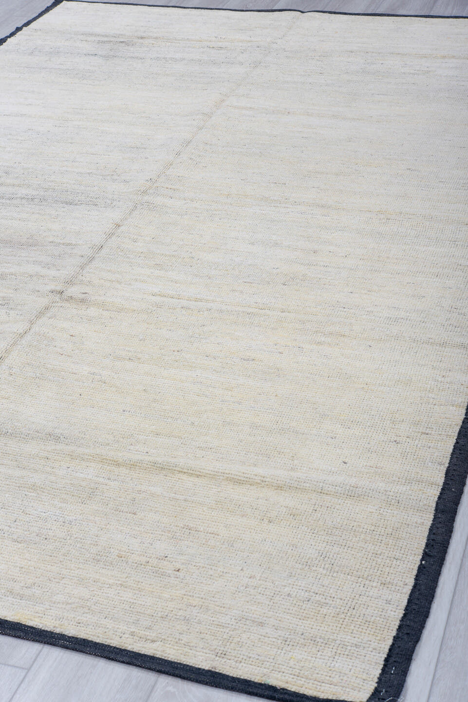 6' x 9' one-of-a-kind handmade vintage Tulu medium size rug. Color palette: ivory, charcoal, cream, taupe, gray, black