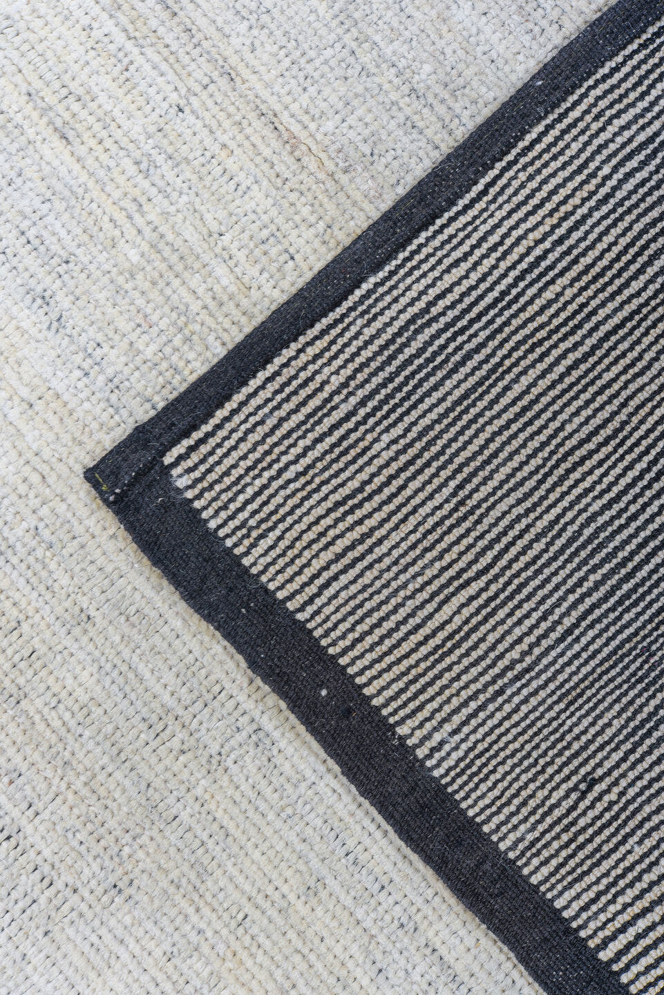 6' x 9' one-of-a-kind handmade vintage Tulu medium size rug. Color palette: ivory, charcoal, cream, taupe, gray, black