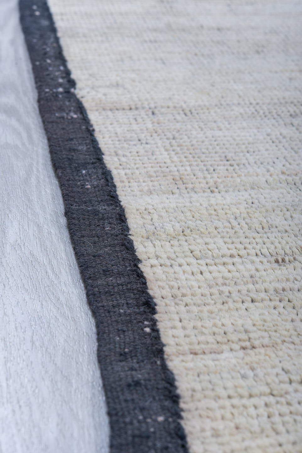 6' x 9' one-of-a-kind handmade vintage Tulu medium size rug. Color palette: ivory, charcoal, cream, taupe, gray, black