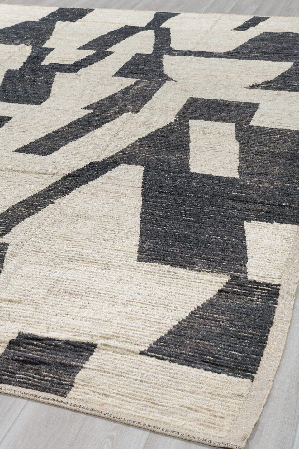 10' x 13' one-of-a-kind handmade vintage Tulu oversize rug. Color palette: ivory, charcoal, cream, black, gray