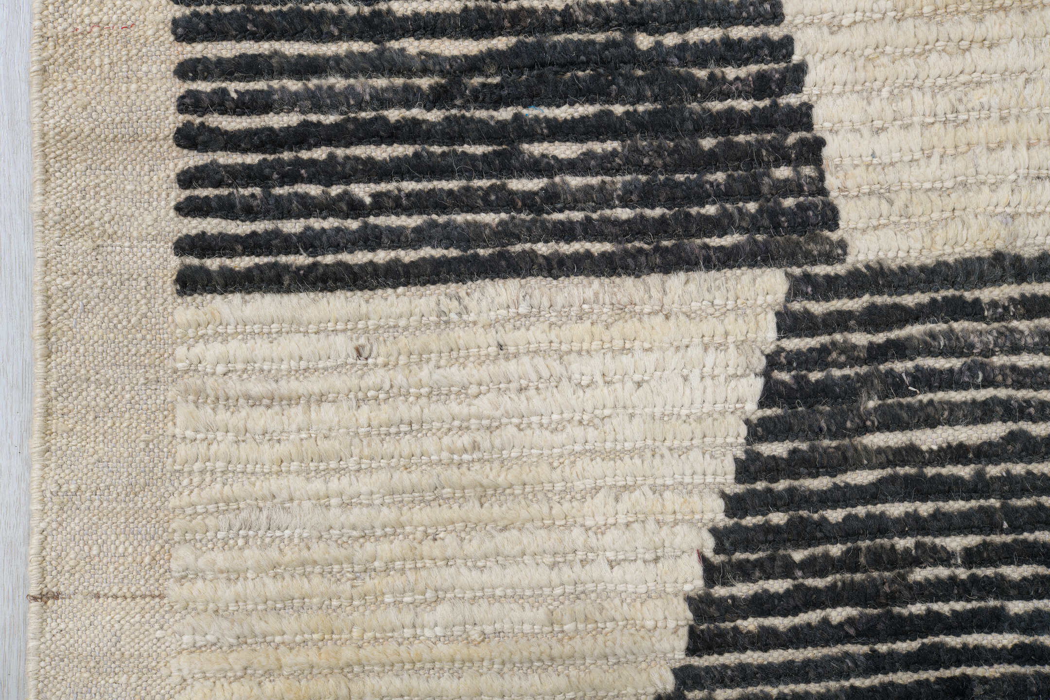 10' x 13' one-of-a-kind handmade vintage Tulu oversize rug. Color palette: ivory, charcoal, cream, black, gray
