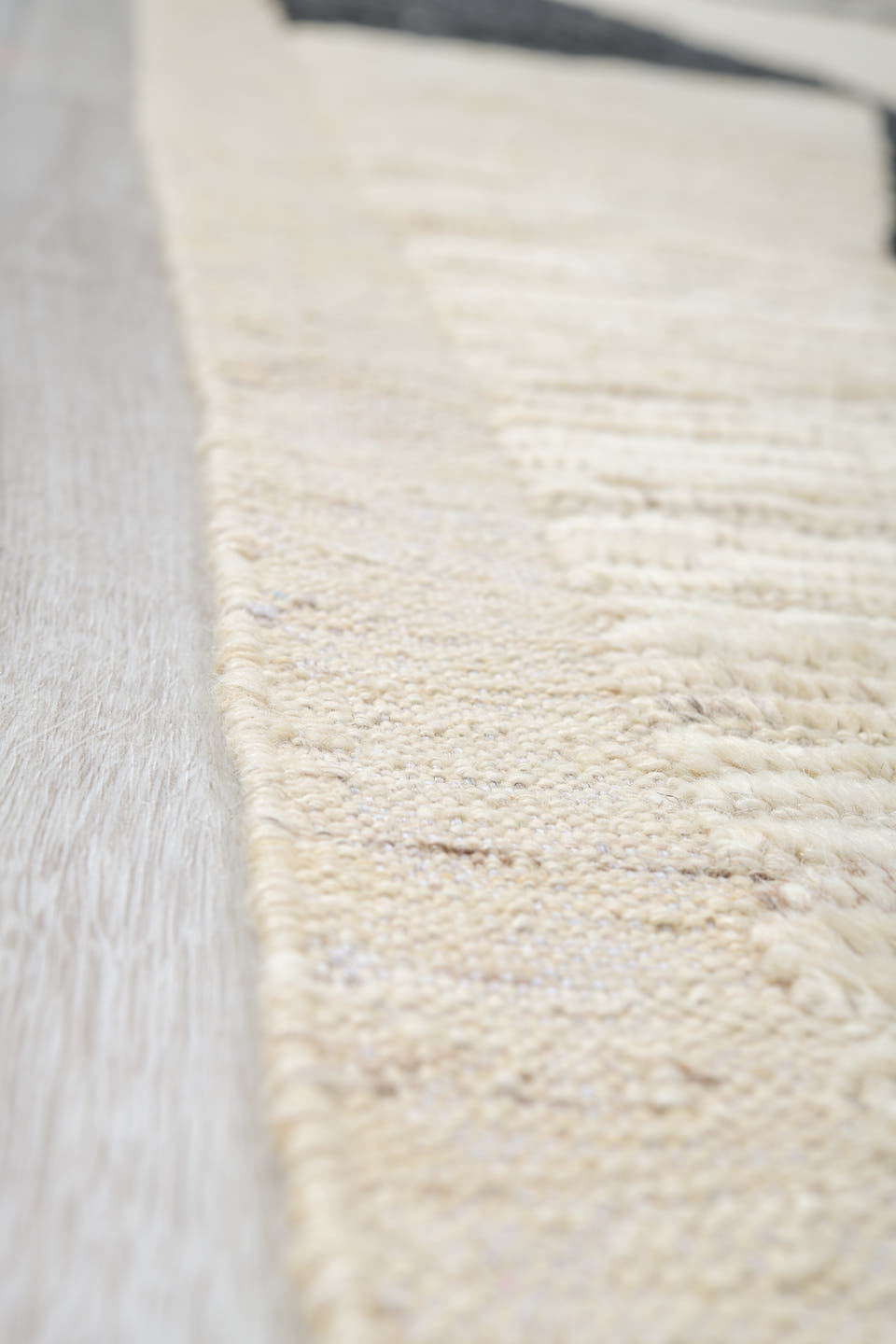 10' x 13' one-of-a-kind handmade vintage Tulu oversize rug. Color palette: ivory, charcoal, cream, black, gray