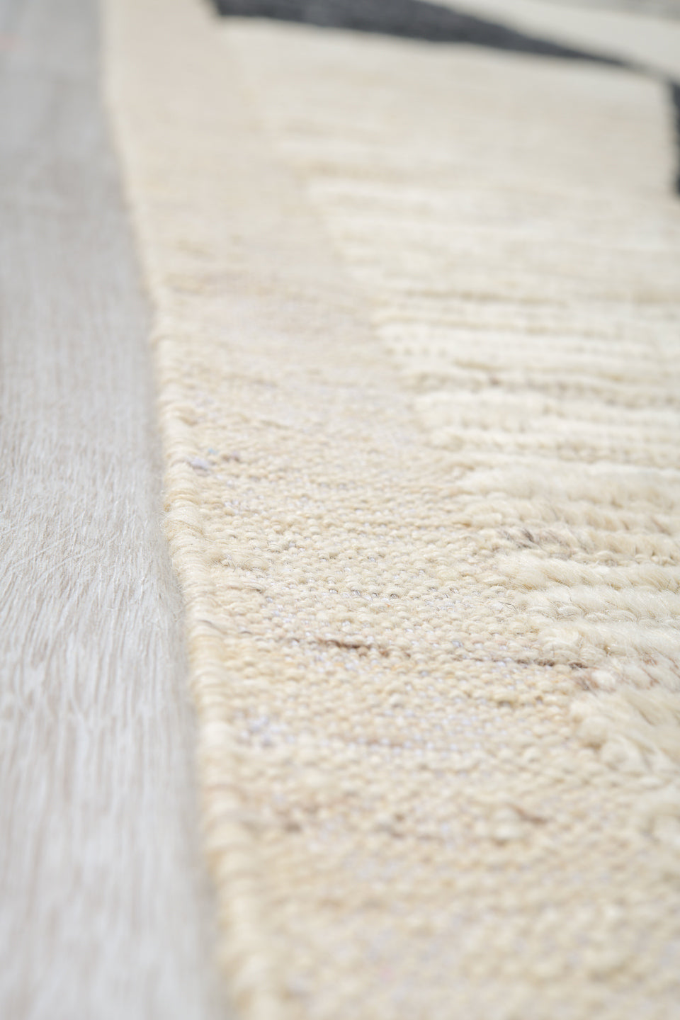 10' x 13' one-of-a-kind handmade vintage Tulu oversize rug. Color palette: ivory, charcoal, cream, black, gray