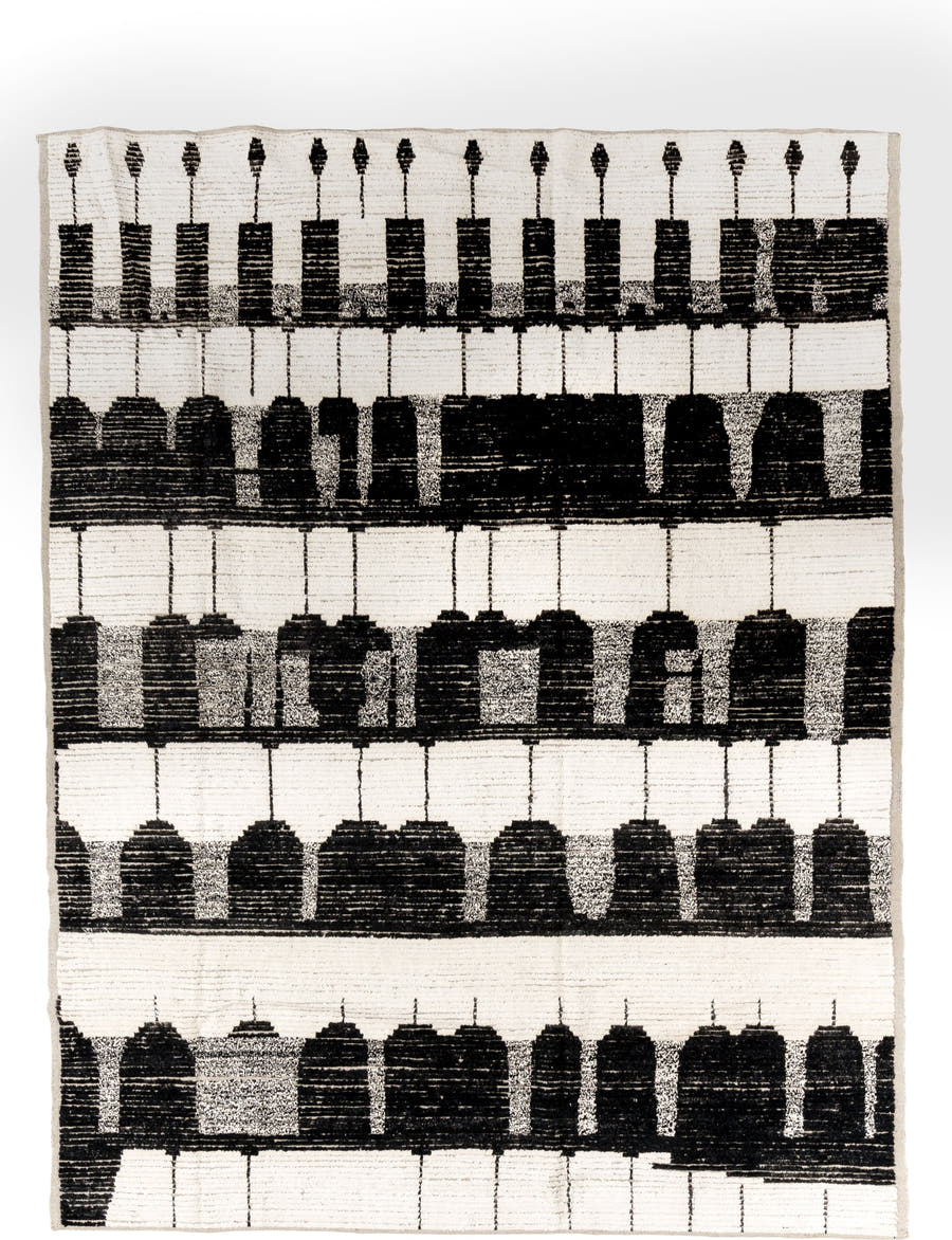 7' x 9' one-of-a-kind handmade vintage Tulu rug. Color palette: ivory, black, charcoal, gray