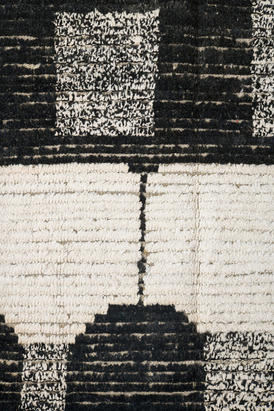 7' x 9' one-of-a-kind handmade vintage Tulu rug. Color palette: ivory, black, charcoal, gray