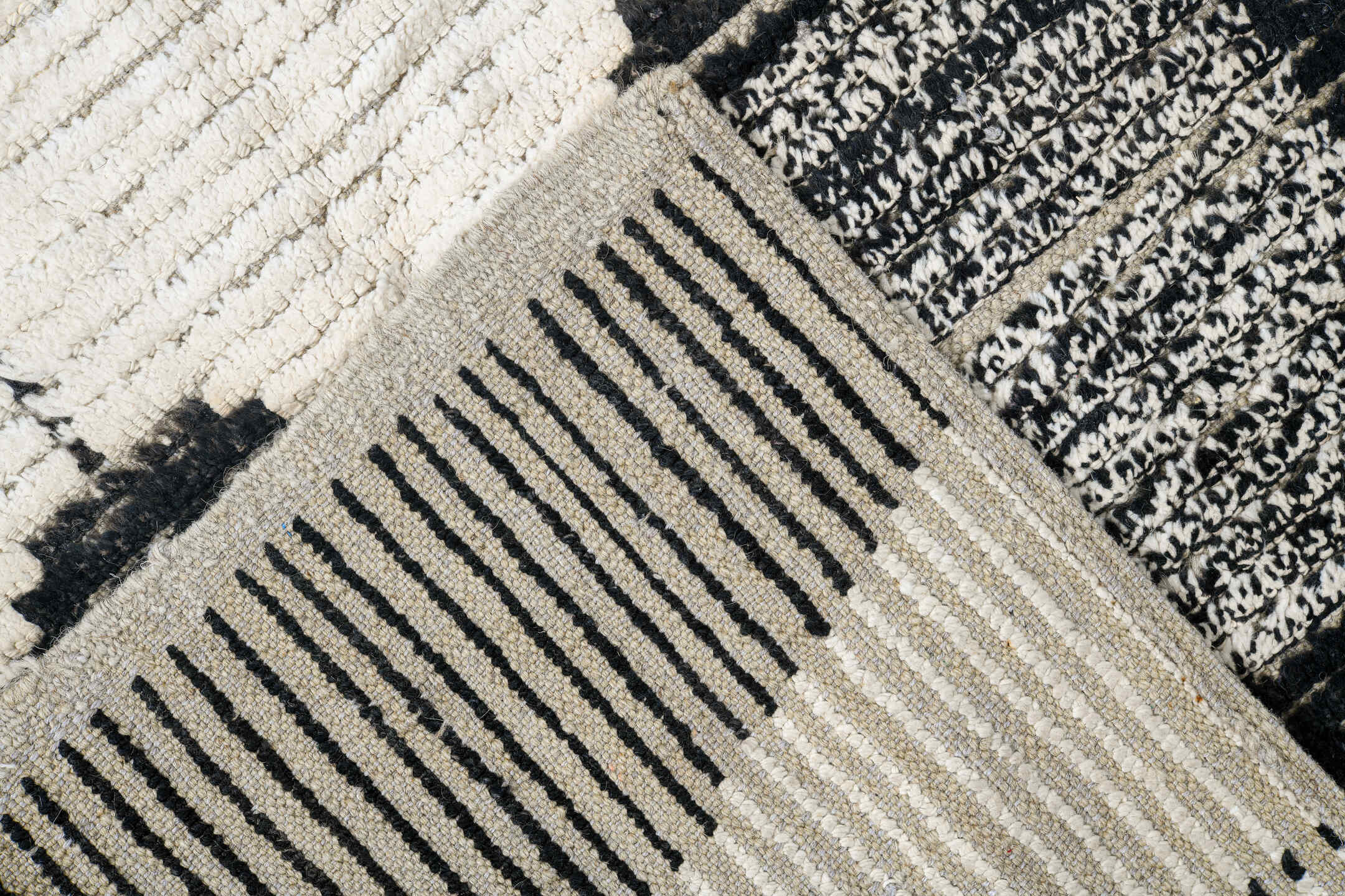 7' x 9' one-of-a-kind handmade vintage Tulu rug. Color palette: ivory, black, charcoal, gray