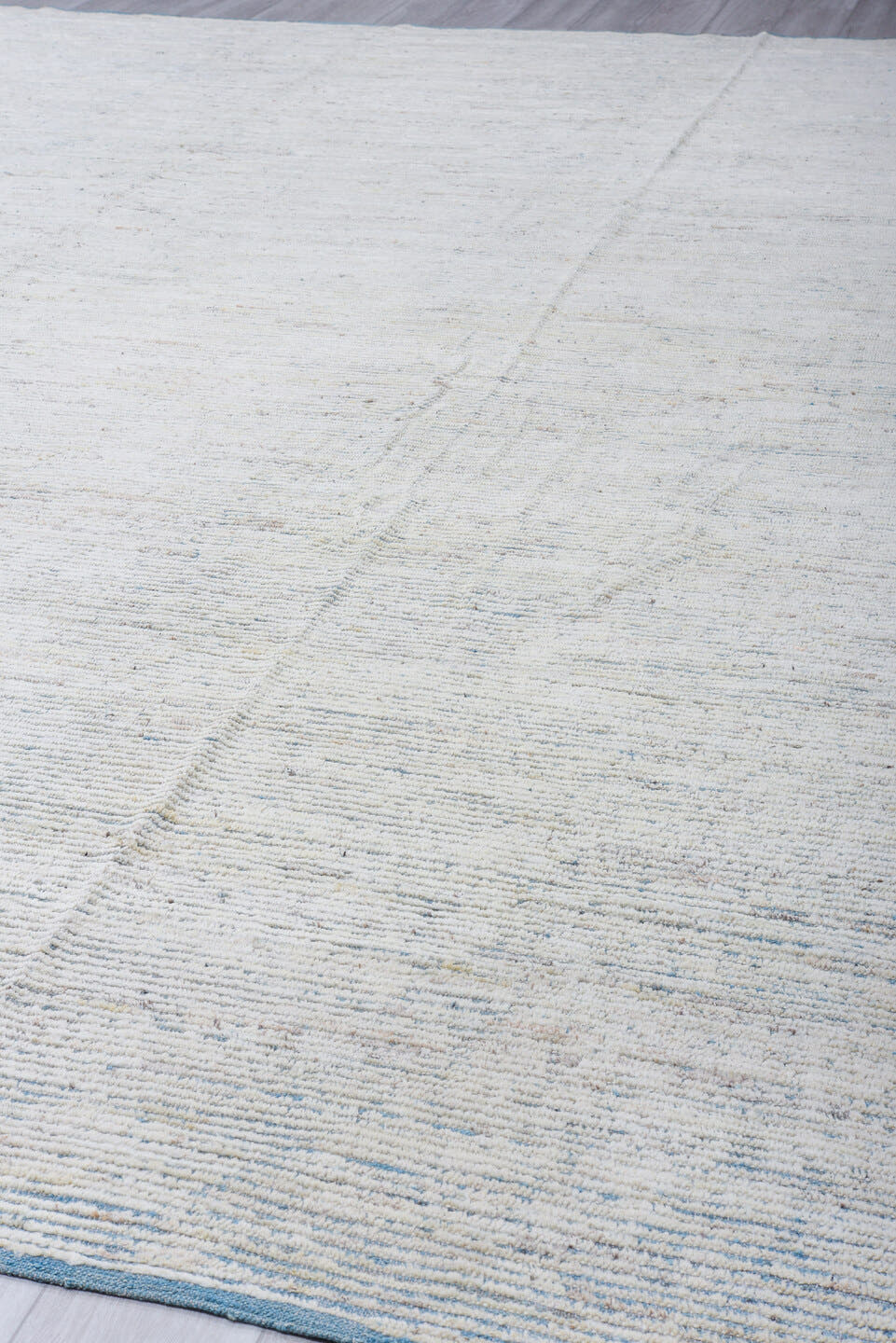 13' x 16' one-of-a-kind handmade vintage Tulu oversize rug. Color palette: ivory, pale blue, cream, light gray, light blue