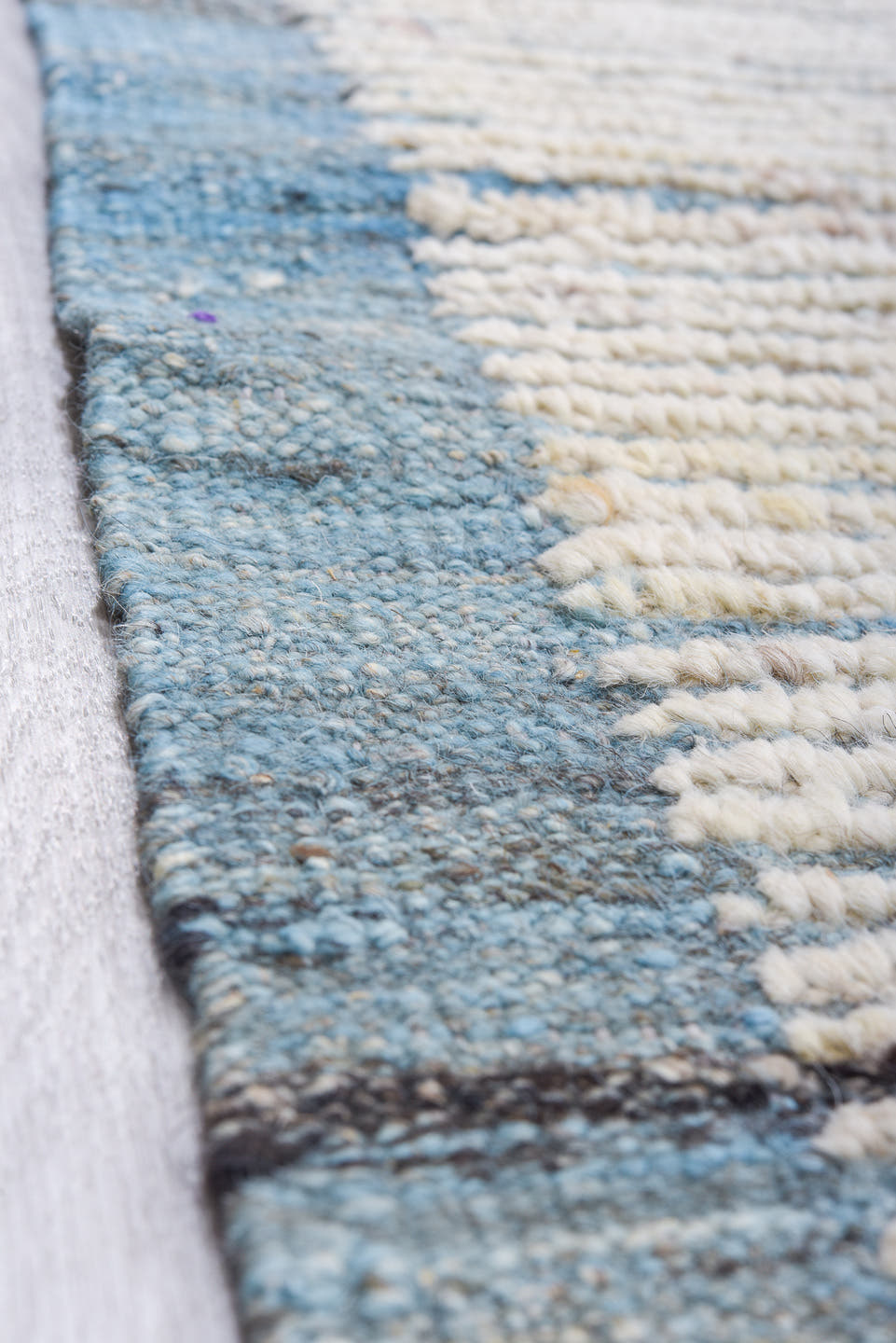 13' x 16' one-of-a-kind handmade vintage Tulu oversize rug. Color palette: ivory, pale blue, cream, light gray, light blue