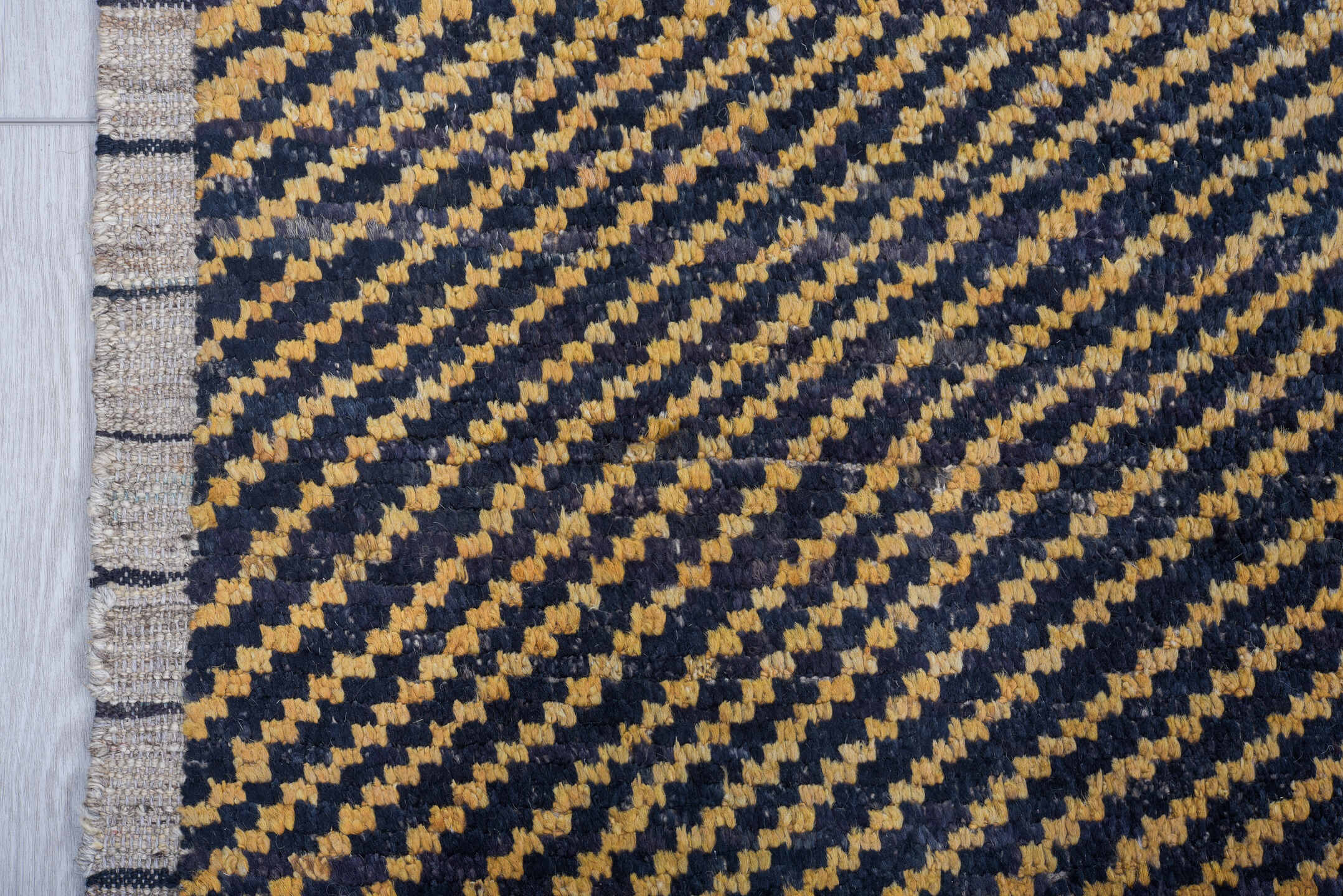7' x 9' one-of-a-kind handmade vintage Tulu rug. Color palette: charcoal, camel, ivory, gray, black, beige