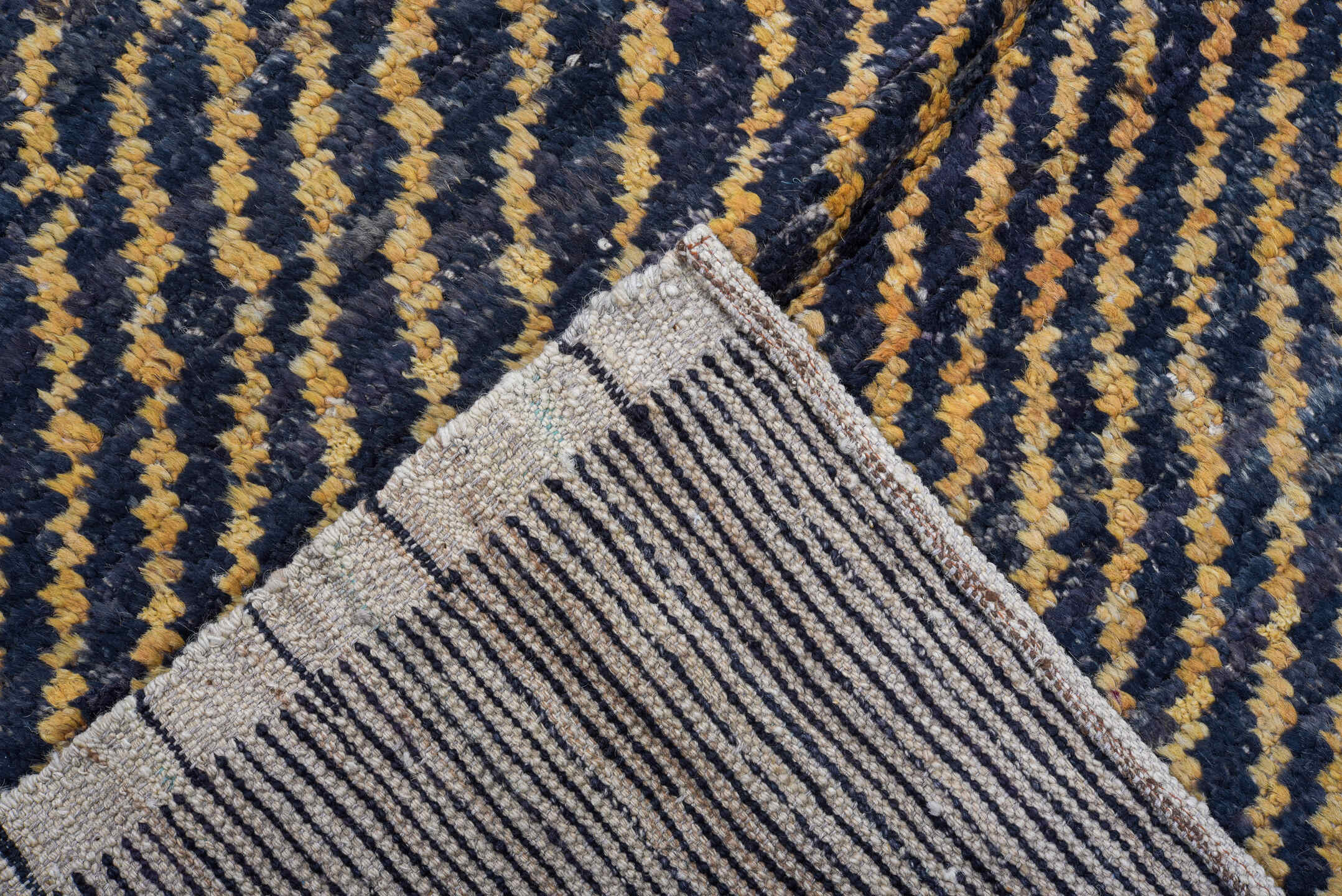 7' x 9' one-of-a-kind handmade vintage Tulu rug. Color palette: charcoal, camel, ivory, gray, black, beige