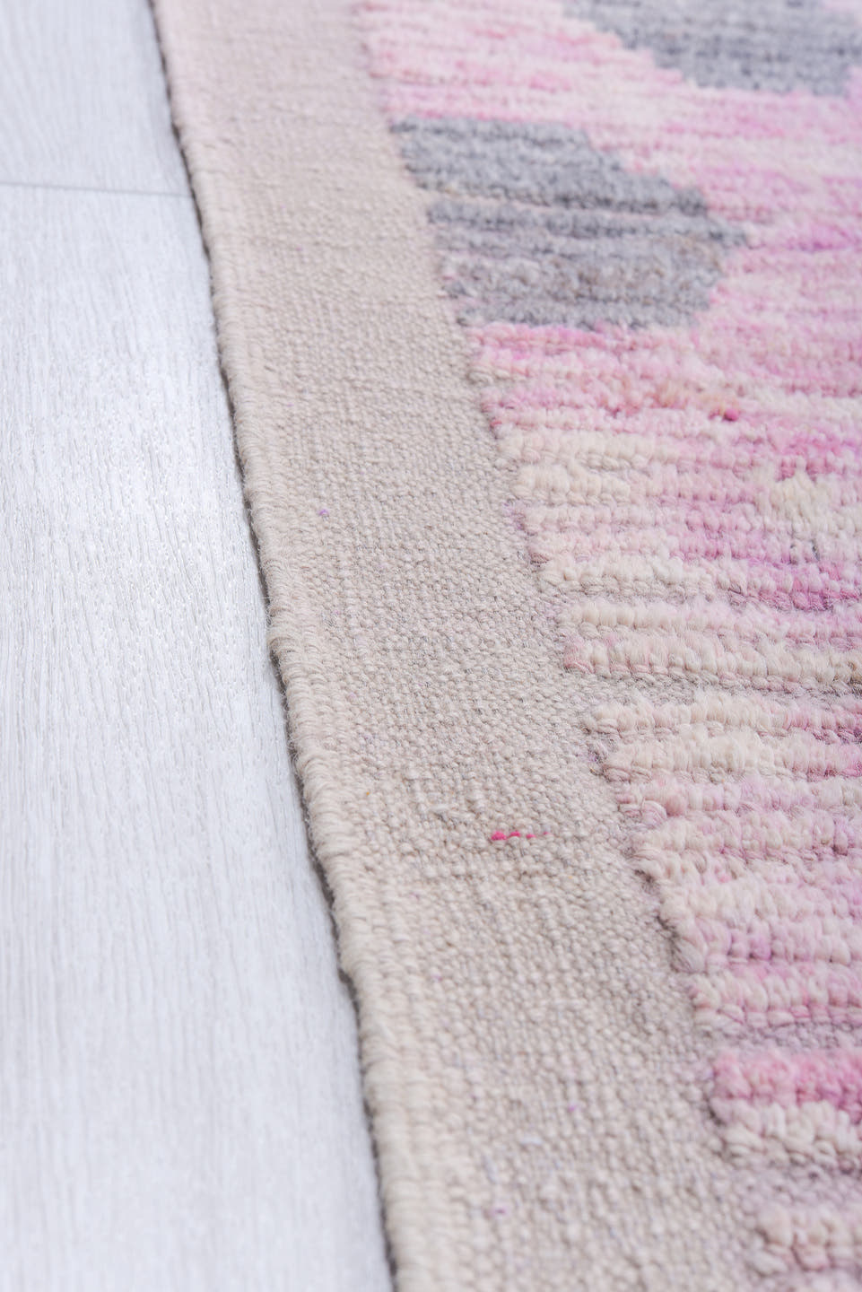 12' x 15' one-of-a-kind handmade vintage Tulu oversize rug. Color palette: pink, ivory, charcoal, gray, black