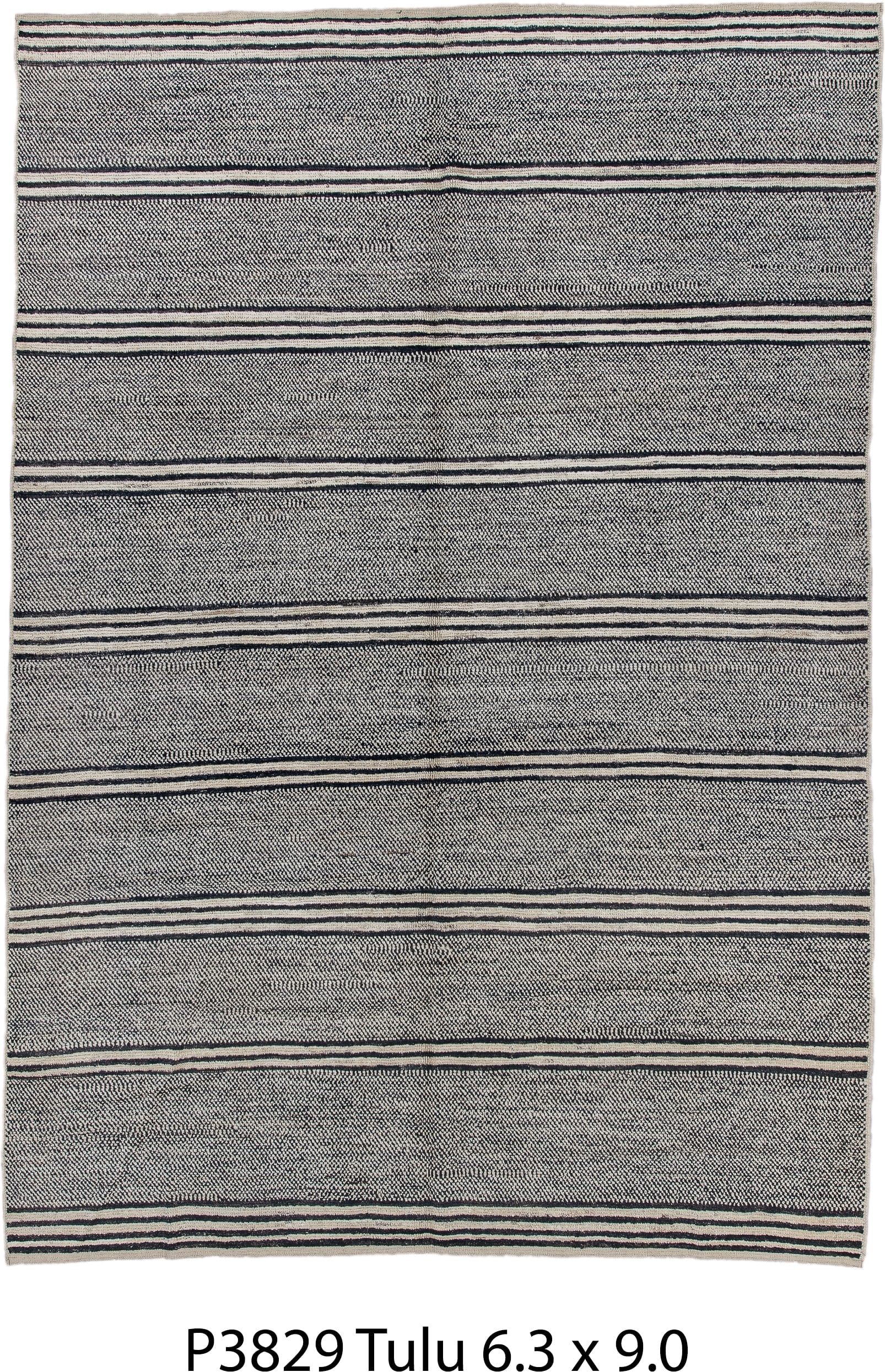 6' x 9' one-of-a-kind handmade vintage Tulu medium size rug. Color palette: charcoal, ivory, gray, black