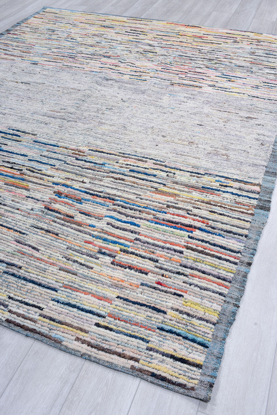 7' x 9' one-of-a-kind handmade vintage Tulu rug. Color palette: gray, ivory, slate, charcoal, taupe, blush, rust, blue