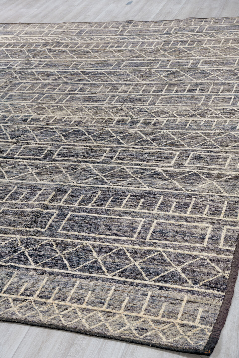 9' x 11' one-of-a-kind handmade vintage Tulu large size rug. Color palette: charcoal, ivory, slate, taupe, gray, black