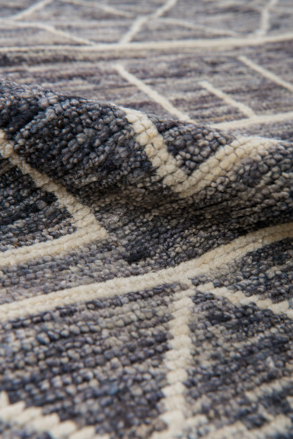 9' x 11' one-of-a-kind handmade vintage Tulu large size rug. Color palette: charcoal, ivory, slate, taupe, gray, black