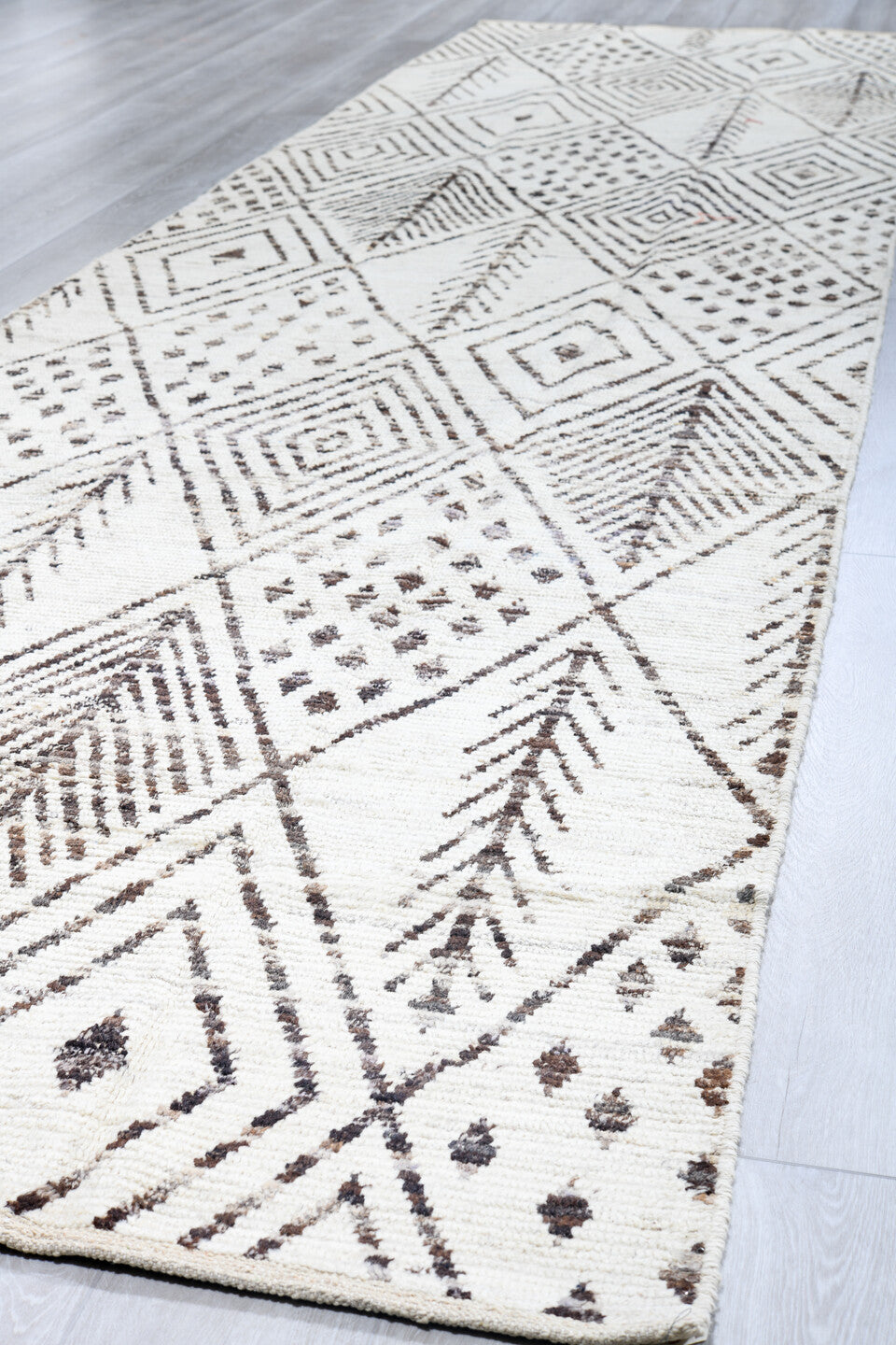 4' x 18' one-of-a-kind handmade vintage Tulu runner rug. Color palette: ivory, charcoal, taupe, brown, black, gray, beige