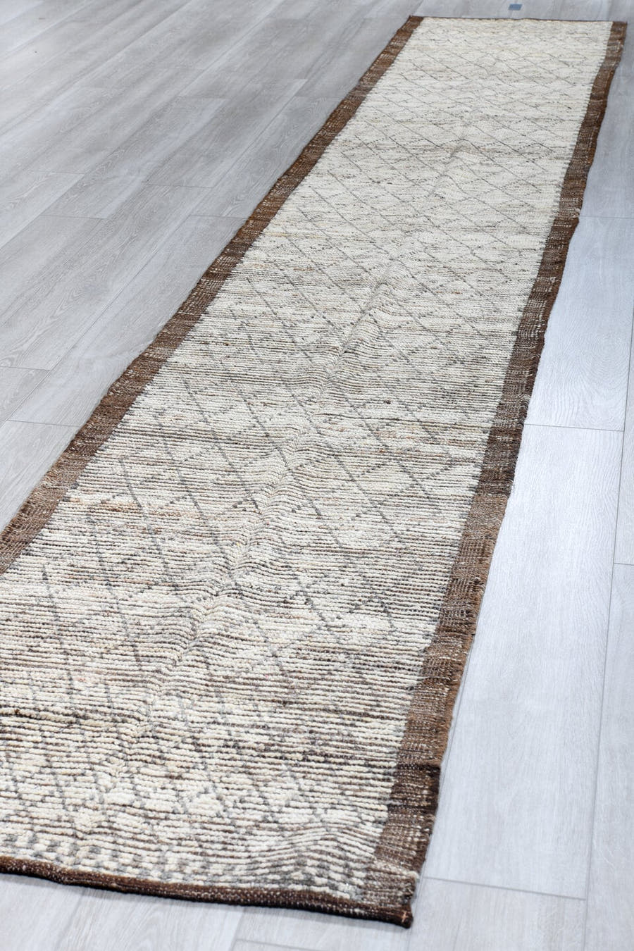2' x 16' one-of-a-kind handmade vintage Tulu runner rug. Color palette: ivory, brown, taupe, charcoal, beige, gray, black