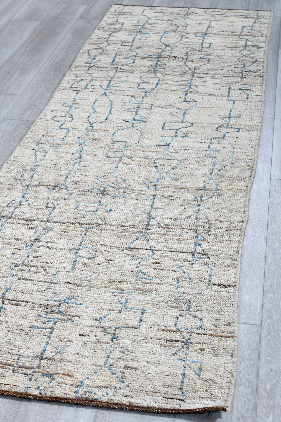 3' x 9' one-of-a-kind handmade vintage Tulu runner rug. Color palette: ivory, blue gray, taupe, brown, gray, blue, beige