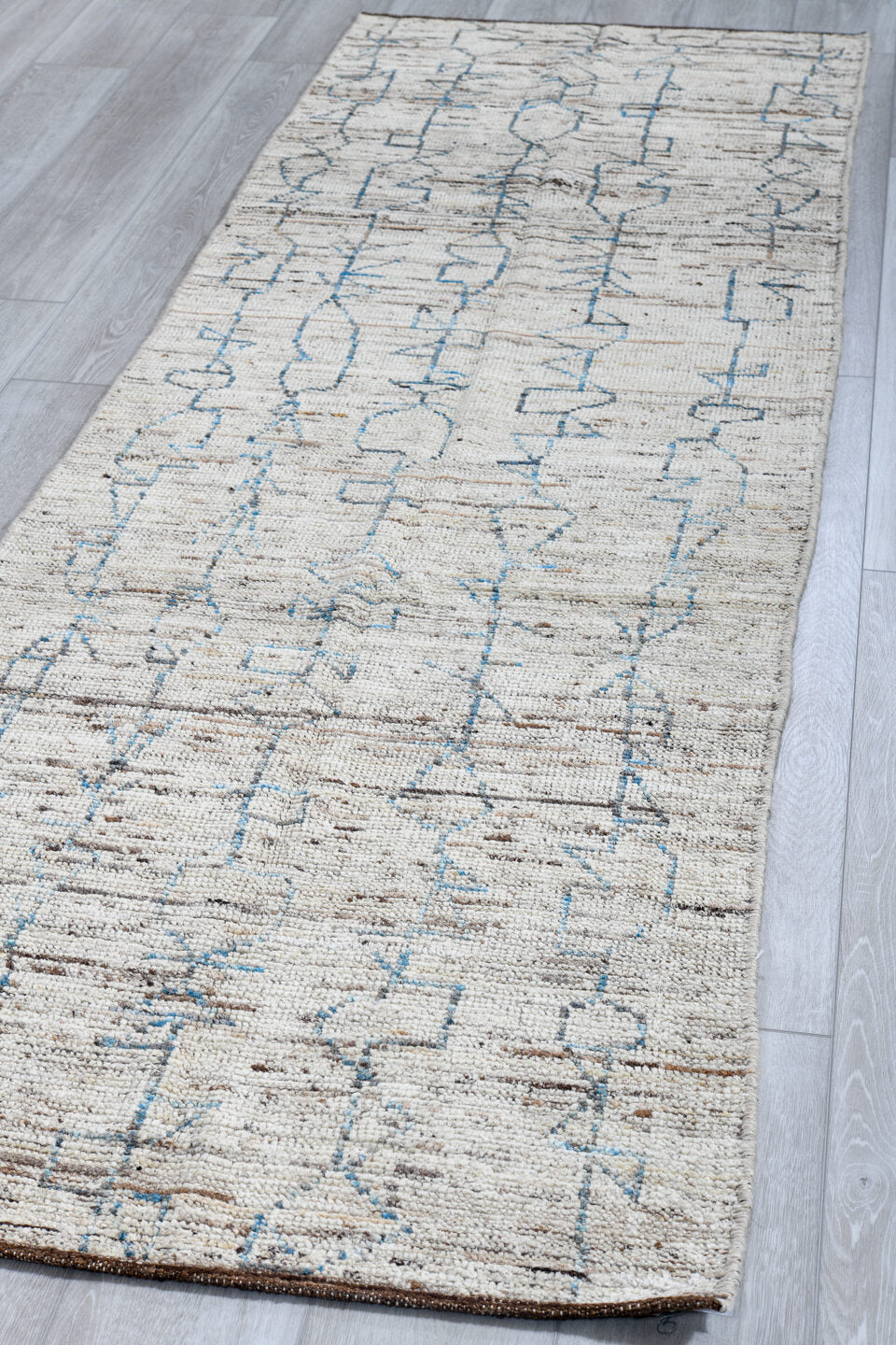 3' x 9' one-of-a-kind handmade vintage Tulu runner rug. Color palette: ivory, blue gray, taupe, brown, gray, blue, beige