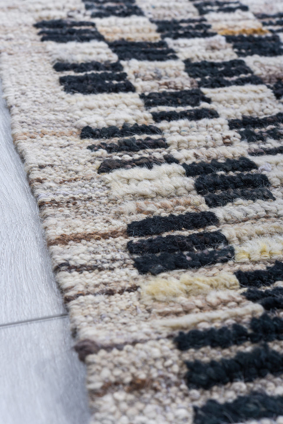 5' x 14' one-of-a-kind handmade vintage Tulu rug. Color palette: ivory, charcoal, gray, slate, blue, ochre, black, gold