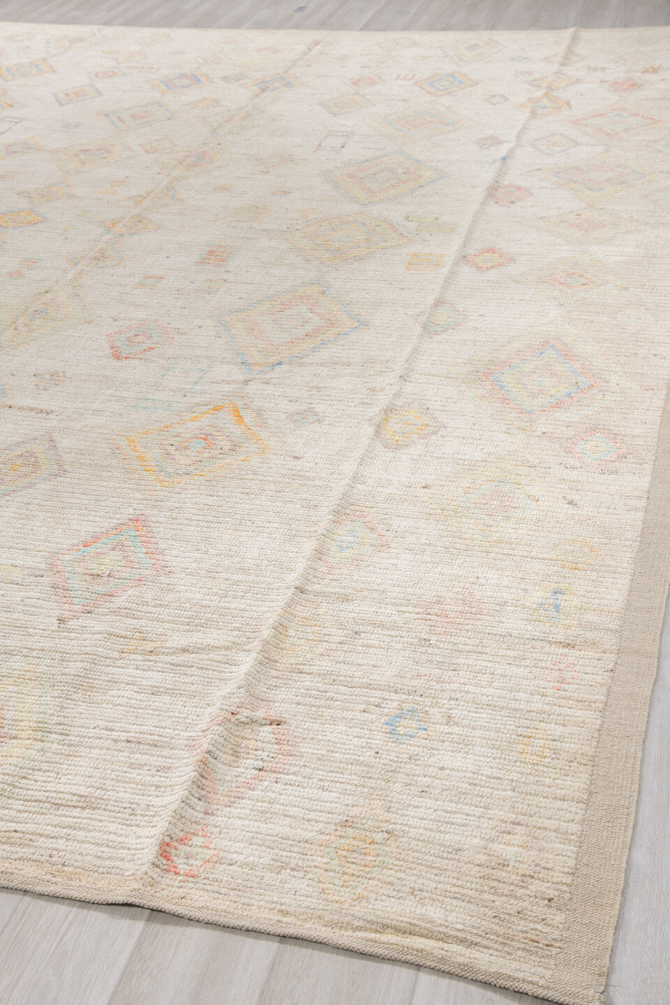 12' x 15' one-of-a-kind handmade vintage Tulu oversize rug. Color palette: ivory, cream, pale blue, coral, gold, sage