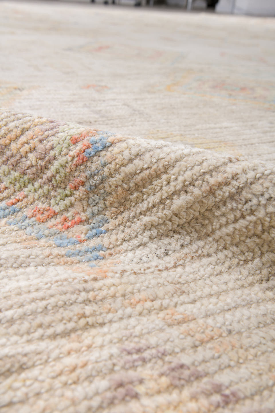 12' x 15' one-of-a-kind handmade vintage Tulu oversize rug. Color palette: ivory, cream, pale blue, coral, gold, sage