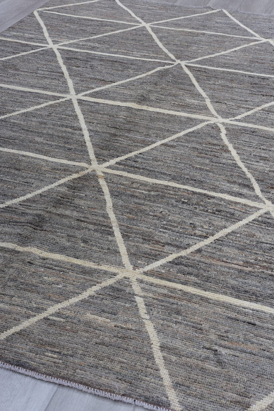 6' x 9' one-of-a-kind handmade vintage Tulu medium size rug. Color palette: gray, ivory, taupe, charcoal, beige, black