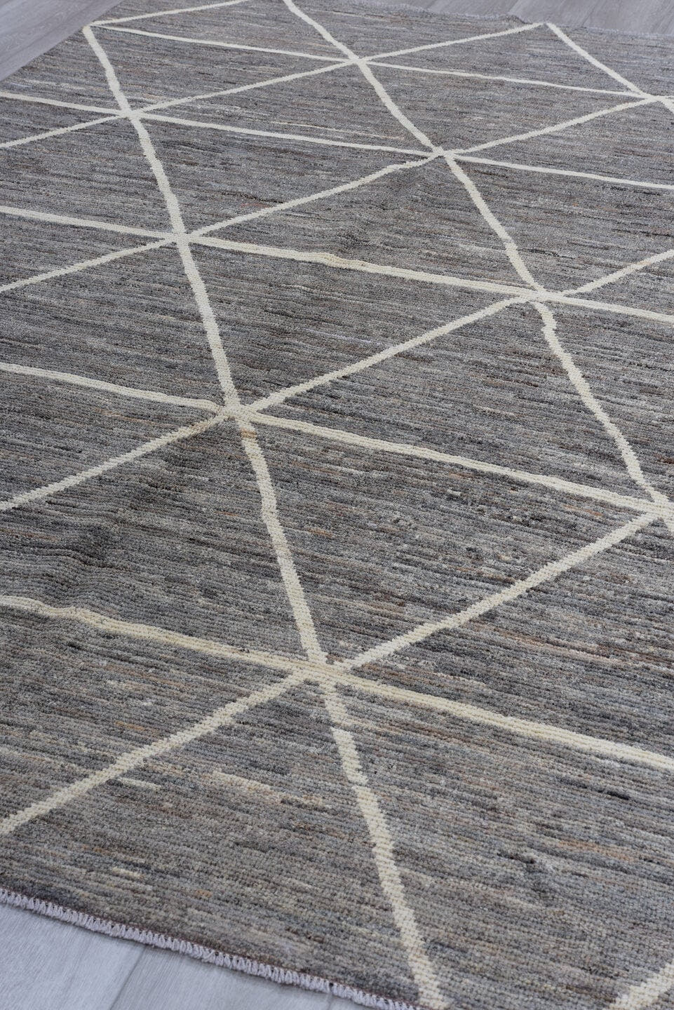 6' x 9' one-of-a-kind handmade vintage Tulu medium size rug. Color palette: gray, ivory, taupe, charcoal, beige, black