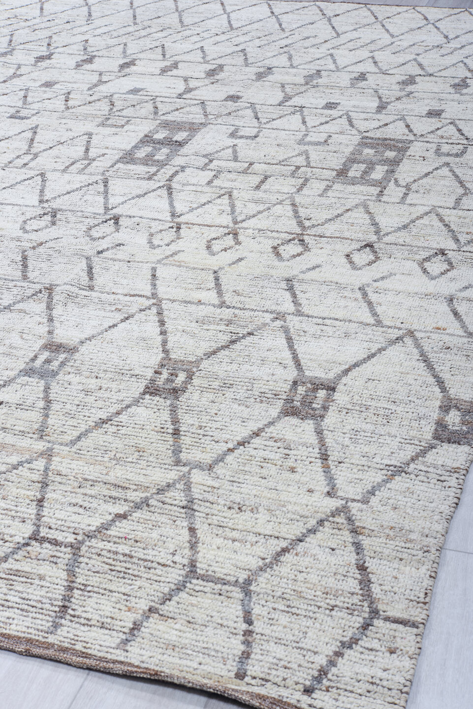 10' x 13' one-of-a-kind handmade vintage Tulu large size rug. Color palette: ivory, charcoal, taupe, brown, gray, black