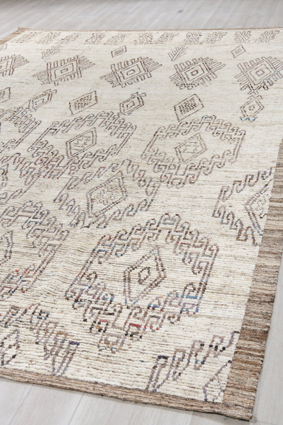 9' x 14' one-of-a-kind handmade vintage Tulu large size rug. Color palette: ivory, brown, taupe, charcoal, muted blue, rust