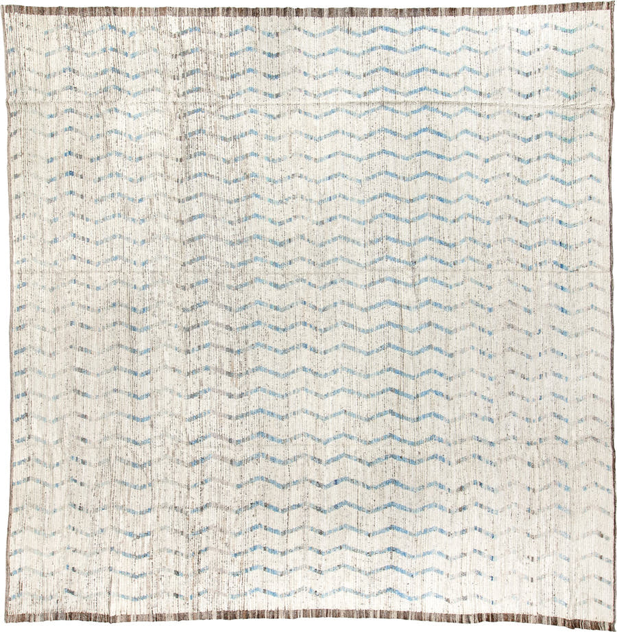 12' x 12' one-of-a-kind handmade vintage Tulu oversize rug. Color palette: ivory, pale blue, taupe, brown, light blue, beige