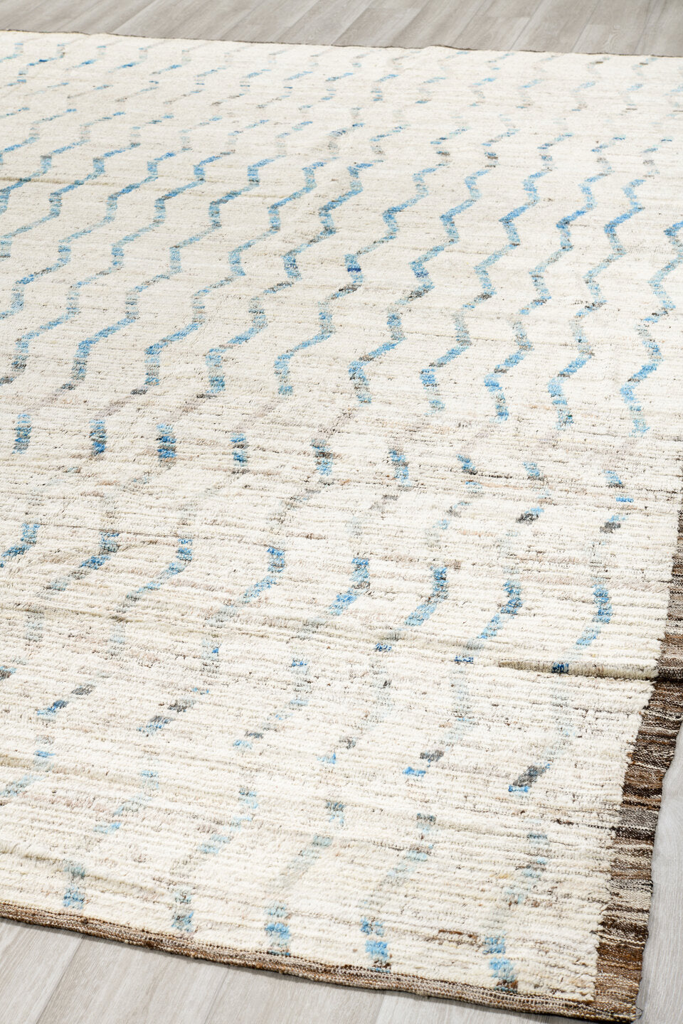 12' x 12' one-of-a-kind handmade vintage Tulu oversize rug. Color palette: ivory, pale blue, taupe, brown, light blue, beige