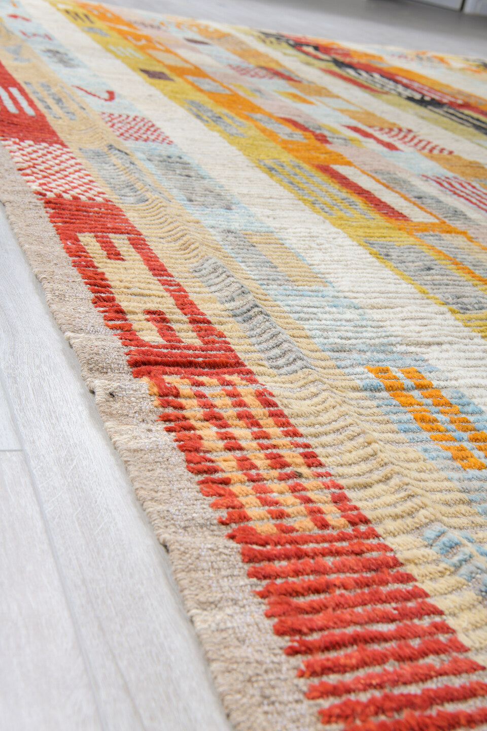 10' x 13' one-of-a-kind handmade vintage Tulu oversize rug. Color palette: ivory, rust, saffron, charcoal, pale blue, sage