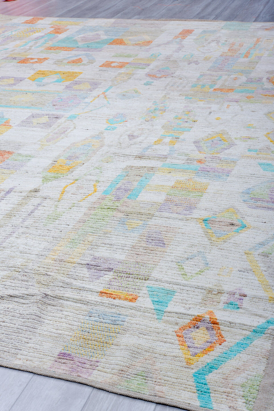12' x 15' one-of-a-kind handmade vintage Tulu oversize rug. Color palette: ivory, aqua, lavender, apricot, pale blue, sage