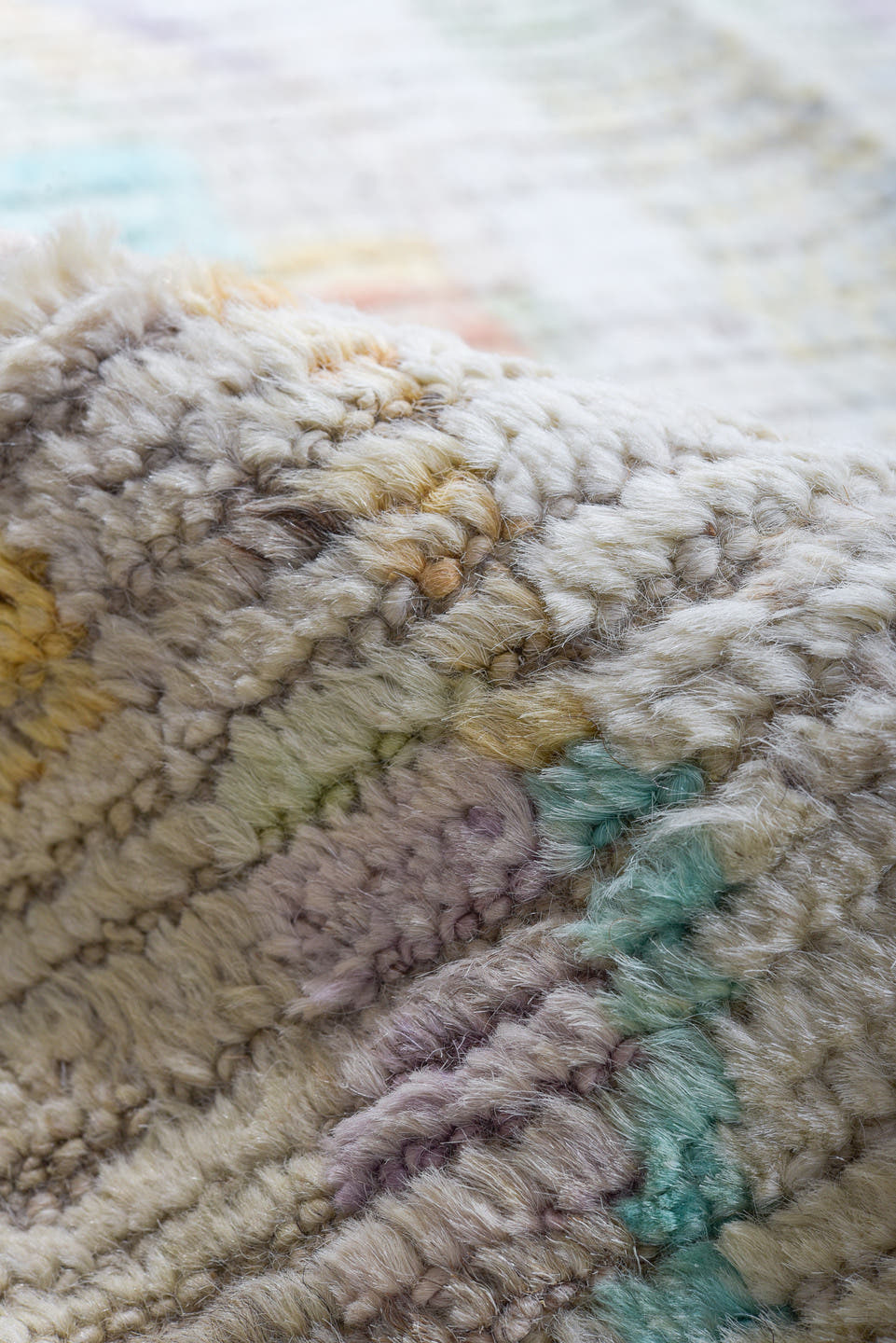 12' x 15' one-of-a-kind handmade vintage Tulu oversize rug. Color palette: ivory, aqua, lavender, apricot, pale blue, sage
