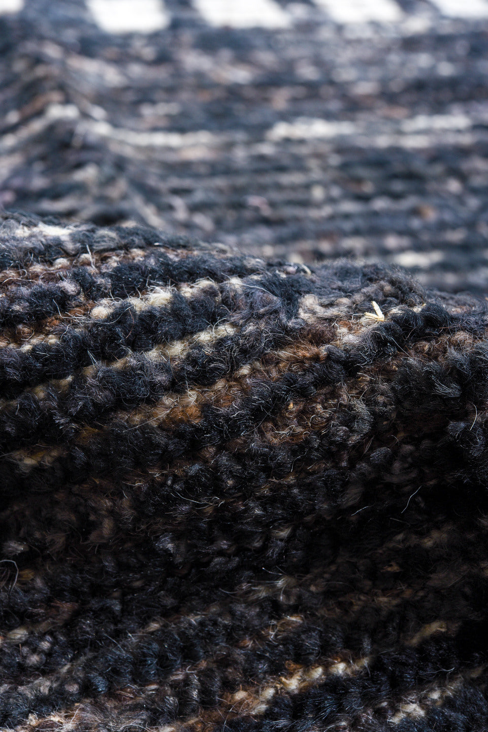 10' x 14' one-of-a-kind handmade vintage Tulu oversize rug. Color palette: charcoal, ivory, slate, taupe, ebony, black, gray
